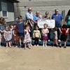 Pictured: Ralls County Presiding Commissioner John Lake, Little Steps Daycare Owner Rhonda Thompson, Mark Twain Regional Council of Governments Ashley Long, Ralls County Western District Commissioner Brian Hodges, Little Steps Daycare Staff and Students