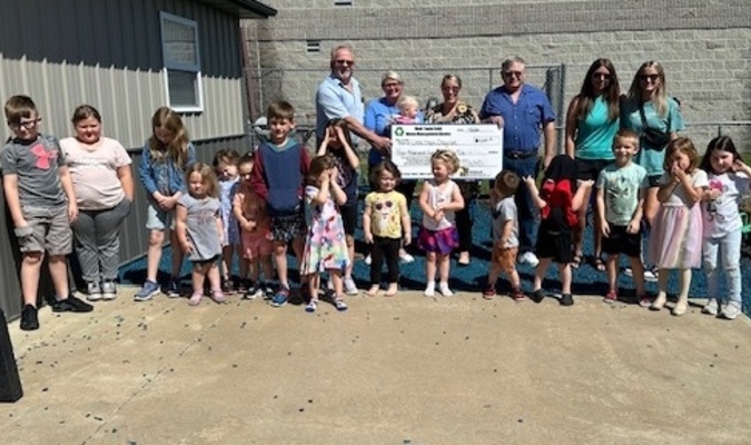Pictured: Ralls County Presiding Commissioner John Lake, Little Steps Daycare Owner Rhonda Thompson, Mark Twain Regional Council of Governments Ashley Long, Ralls County Western District Commissioner Brian Hodges, Little Steps Daycare Staff and Students